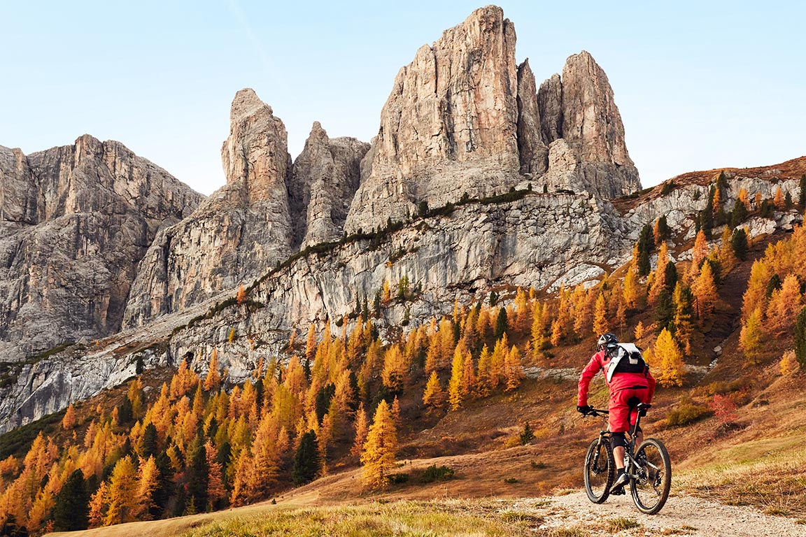 Mountain bike ride in the Dolomites Val Gardena in autumn