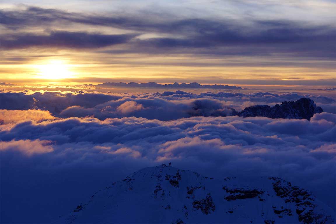 Helicopter flight - Above the clouds on the Piz Boè