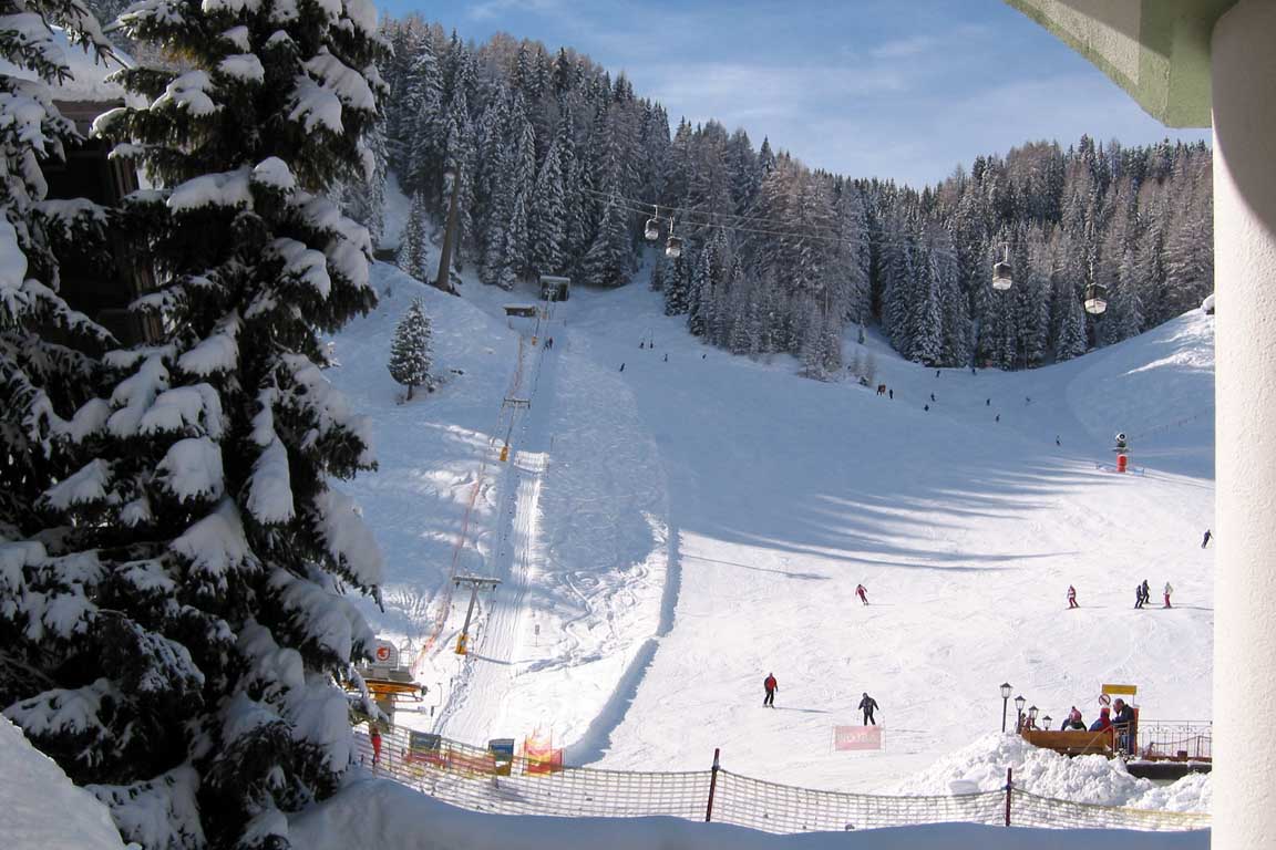 View from the Garni Hotel towards the ski run in Dolomites Italy