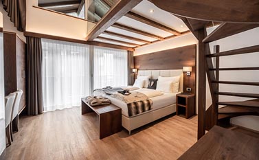 Bedrooms at Garni Hotel Arya Alpine Lodge